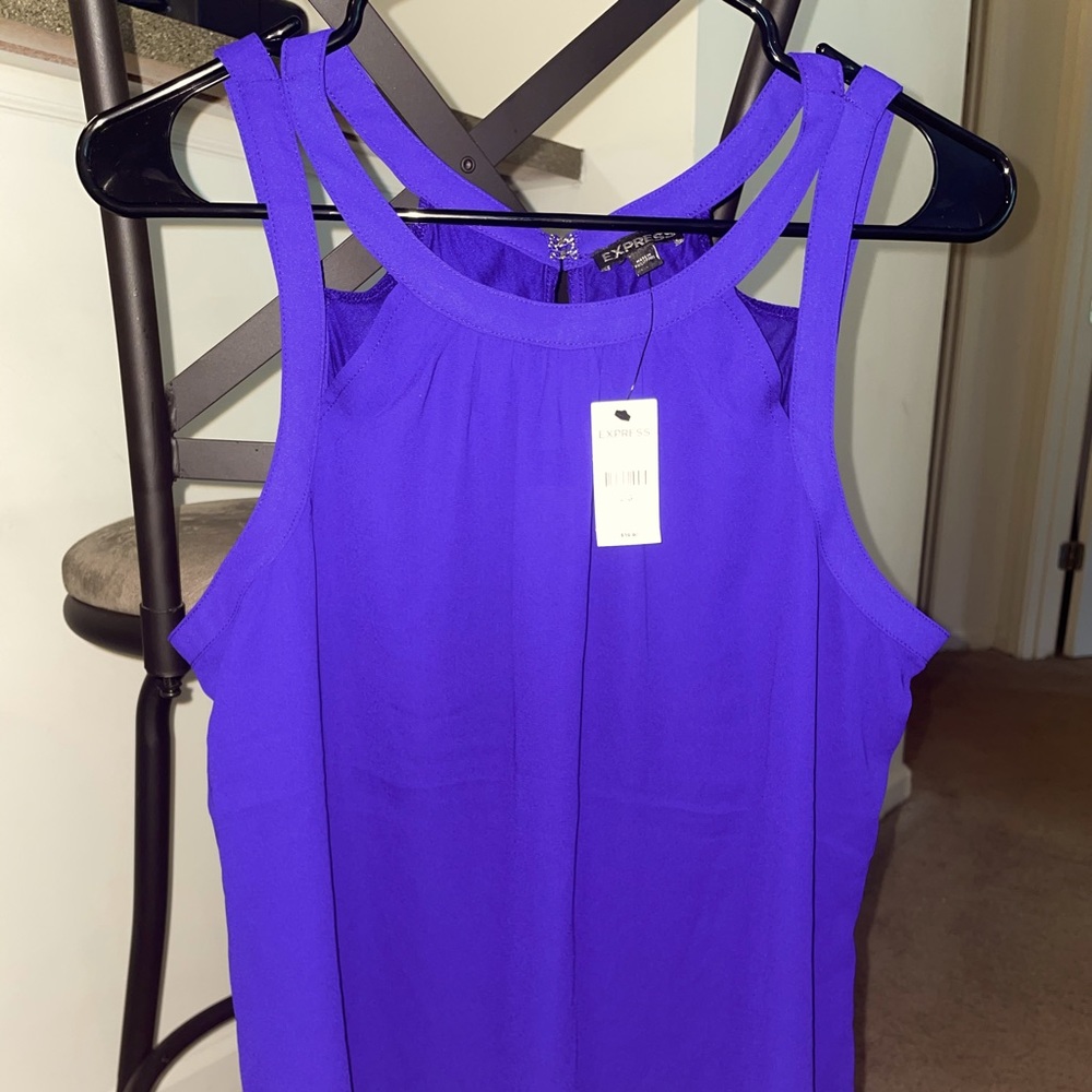Purple sleeveless top perfect under a work blazer.